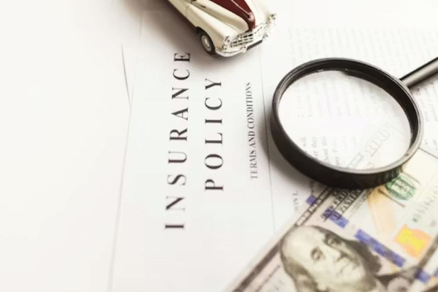 Person signing insurance paperwork